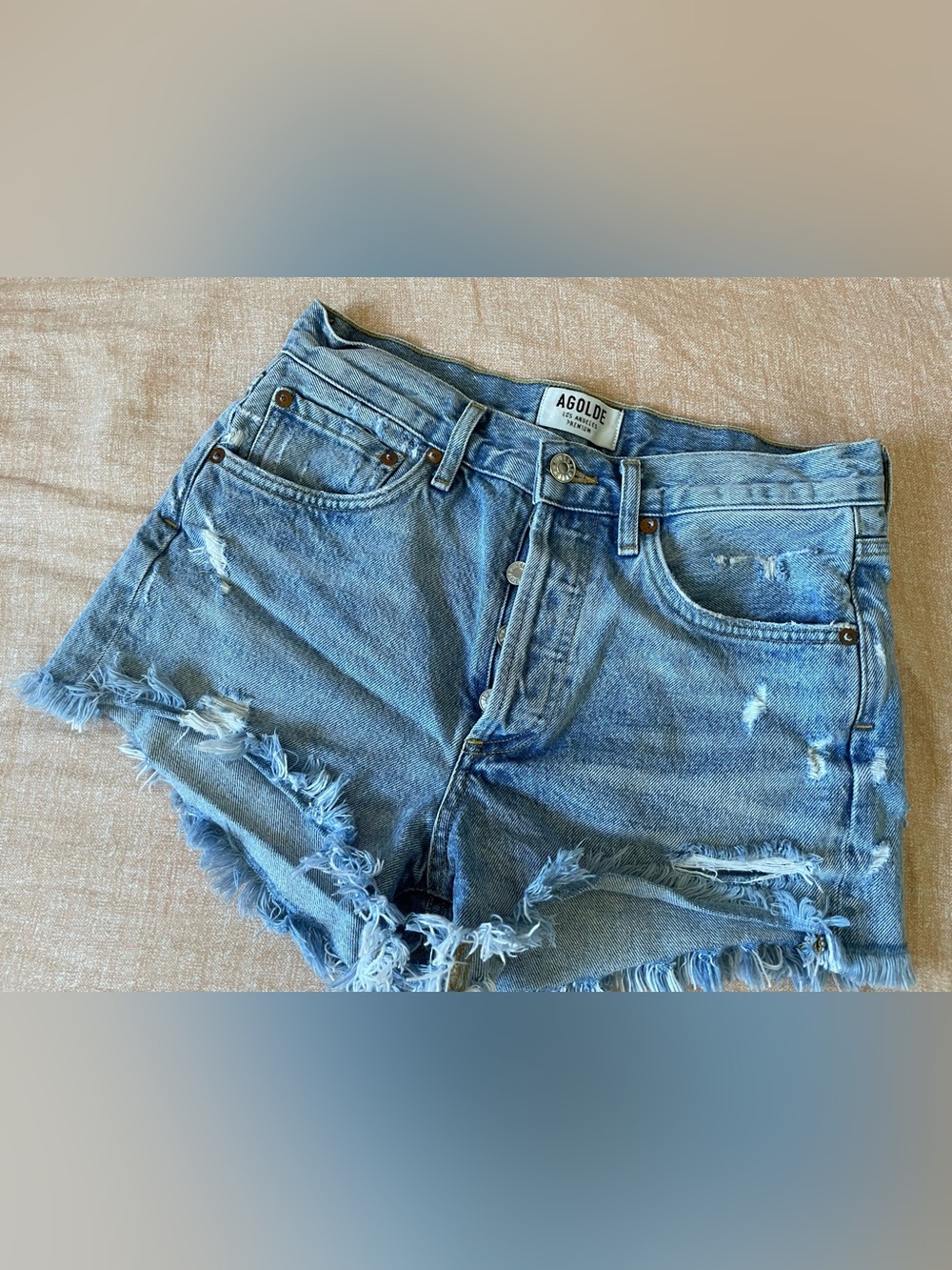 Size 24 is AGOLDE Light Blue Distressed Denim Shorts